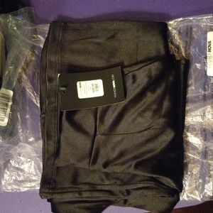 Fashion Nova black satin bell bottom pants.